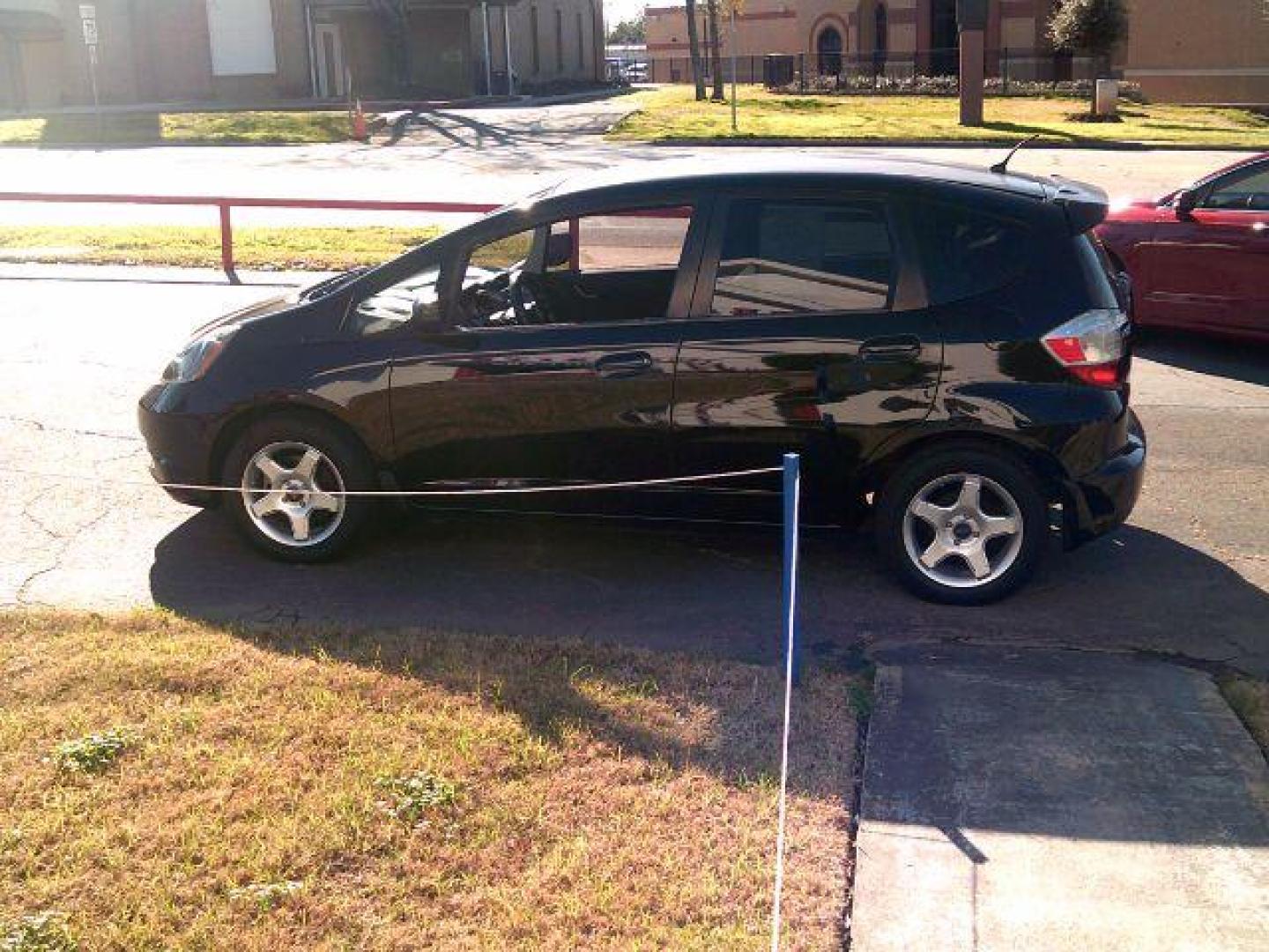 2009 Crystal Black Pearl Honda Fit 5-Speed MT (JHMGE87219S) with an 1.5L L4 SOHC 16V engine, 5-Speed Manual transmission, located at 116 N. Frazier Street, Conroe, TX, 77301, (936) 647-0690, 30.308662, -95.460480 - Photo#3