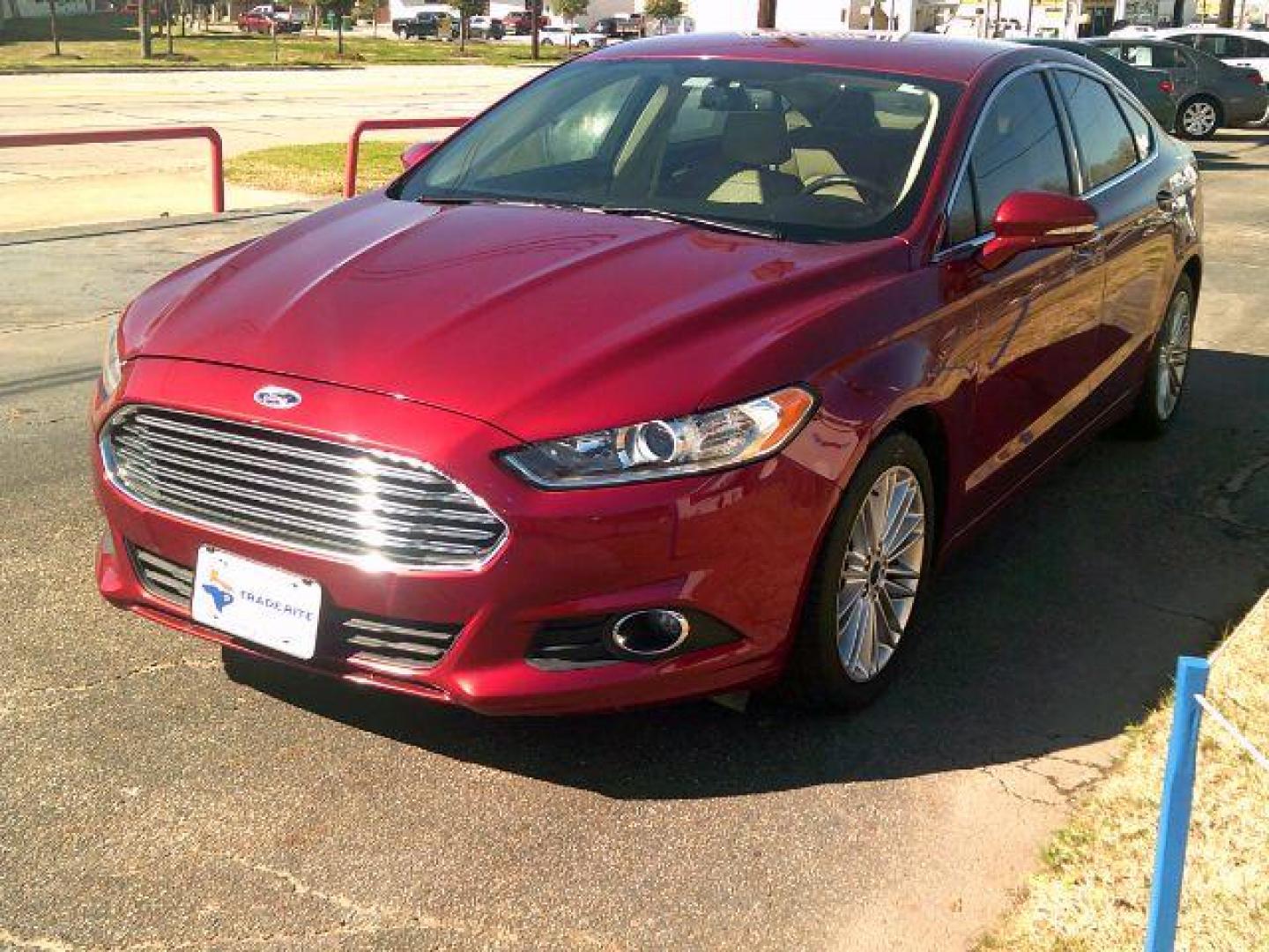 2016 Ruby Red Metallic Ti /Dune, leather Ford Fusion SE (3FA6P0HD8GR) with an 1.5L L4 DOHC 16V engine, 6-Speed Automatic transmission, located at 116 N. Frazier Street, Conroe, TX, 77301, (936) 647-0690, 30.308662, -95.460480 - Photo#2