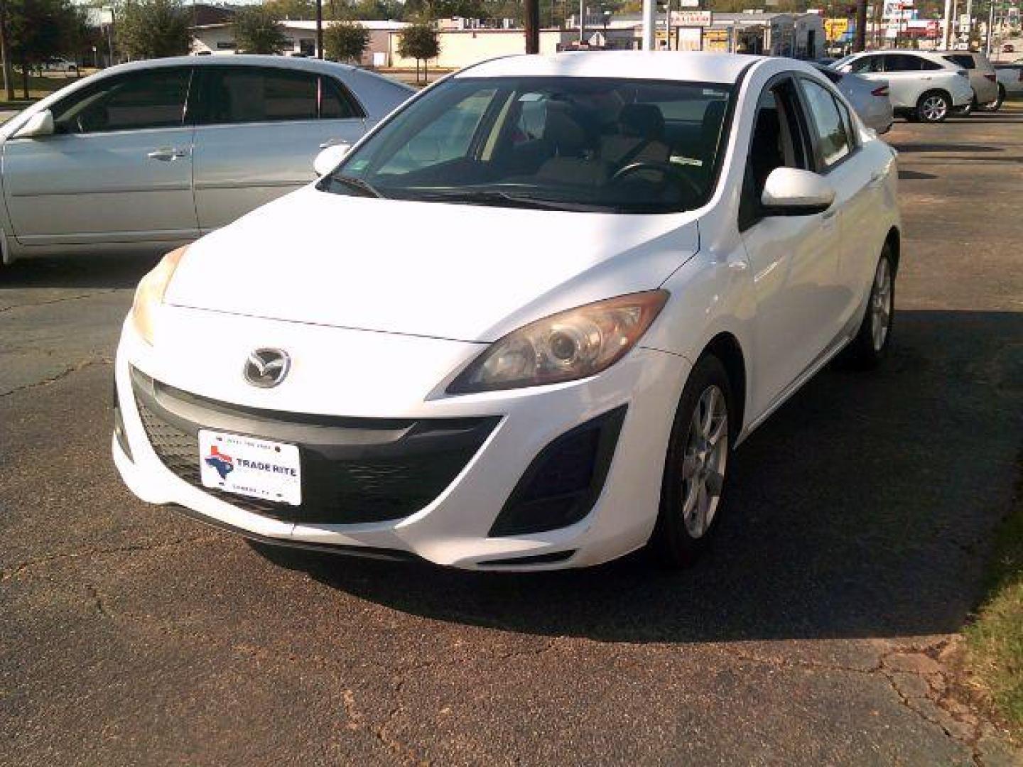 2011 Crystal White Pearl /Dune Cloth Interior Mazda MAZDA3 i Touring 4-Door (JM1BL1VG9B1) with an 2.0L L4 DOHC 16V engine, located at 116 N. Frazier Street, Conroe, TX, 77301, (936) 647-0690, 30.308662, -95.460480 - Photo#2