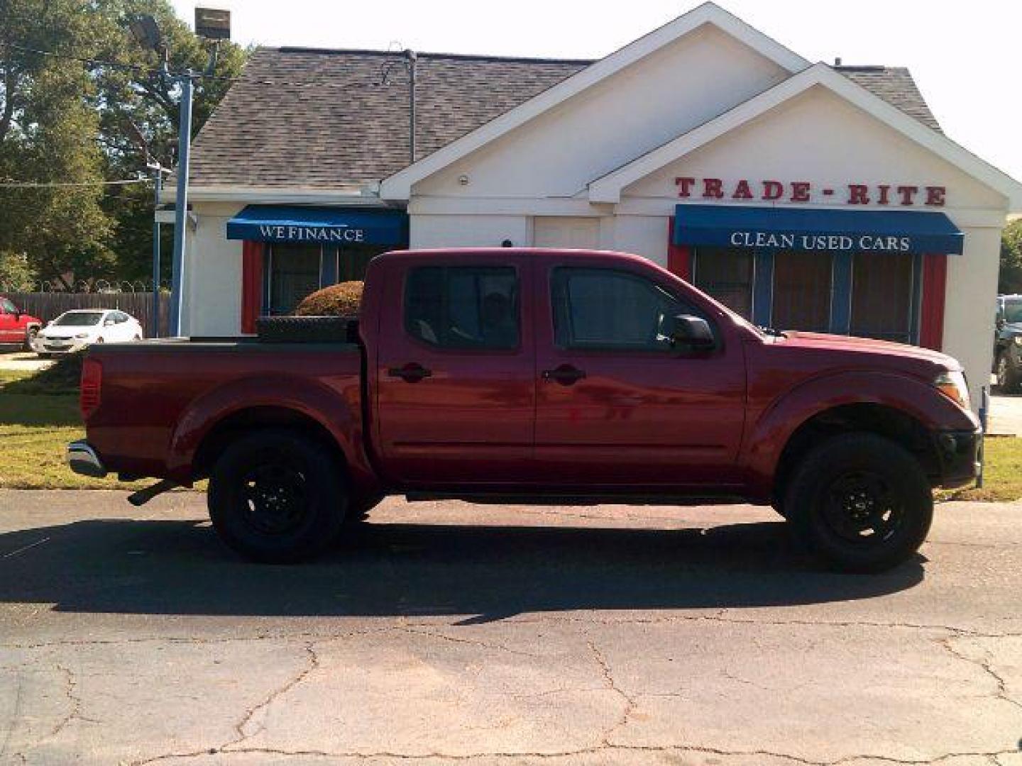 2008 Red Brawn /Beige Cloth Interior Nissan Frontier SE Crew Cab 2WD (1N6AD07U38C) with an 4.0L V6 DOHC 24V engine, 5-Speed Automatic transmission, located at 116 N. Frazier Street, Conroe, TX, 77301, (936) 647-0690, 30.308662, -95.460480 - Photo#0