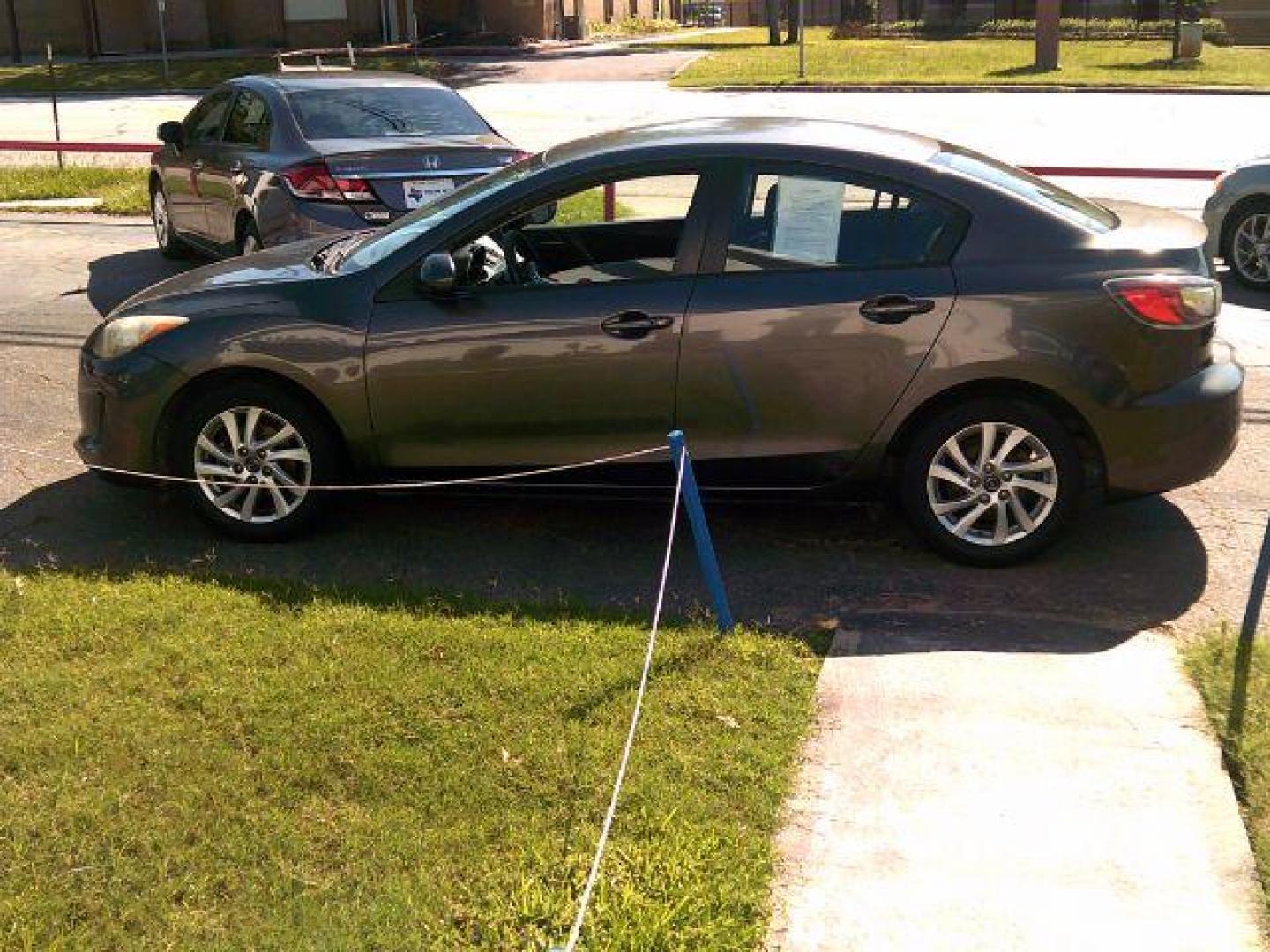 2013 Dolphin Gray Mica /Black Mazda MAZDA3 i Touring AT 4-Door (JM1BL1V7XD1) with an 2.0L L4 DOHC 16V engine, 5-Speed Automatic transmission, located at 116 N. Frazier Street, Conroe, TX, 77301, (936) 647-0690, 30.308662, -95.460480 - Photo#3