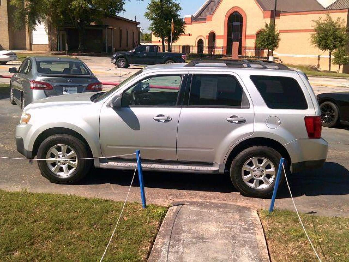 2009 Brilliant Silver Metallic /Gray Leather Interior Mazda Tribute s Grand Touring FWD (4F2CZ06G09K) with an 3.0L V6 DOHC 24V engine, 4-Speed Automatic transmission, located at 116 N. Frazier Street, Conroe, TX, 77301, (936) 647-0690, 30.308662, -95.460480 - Photo#3