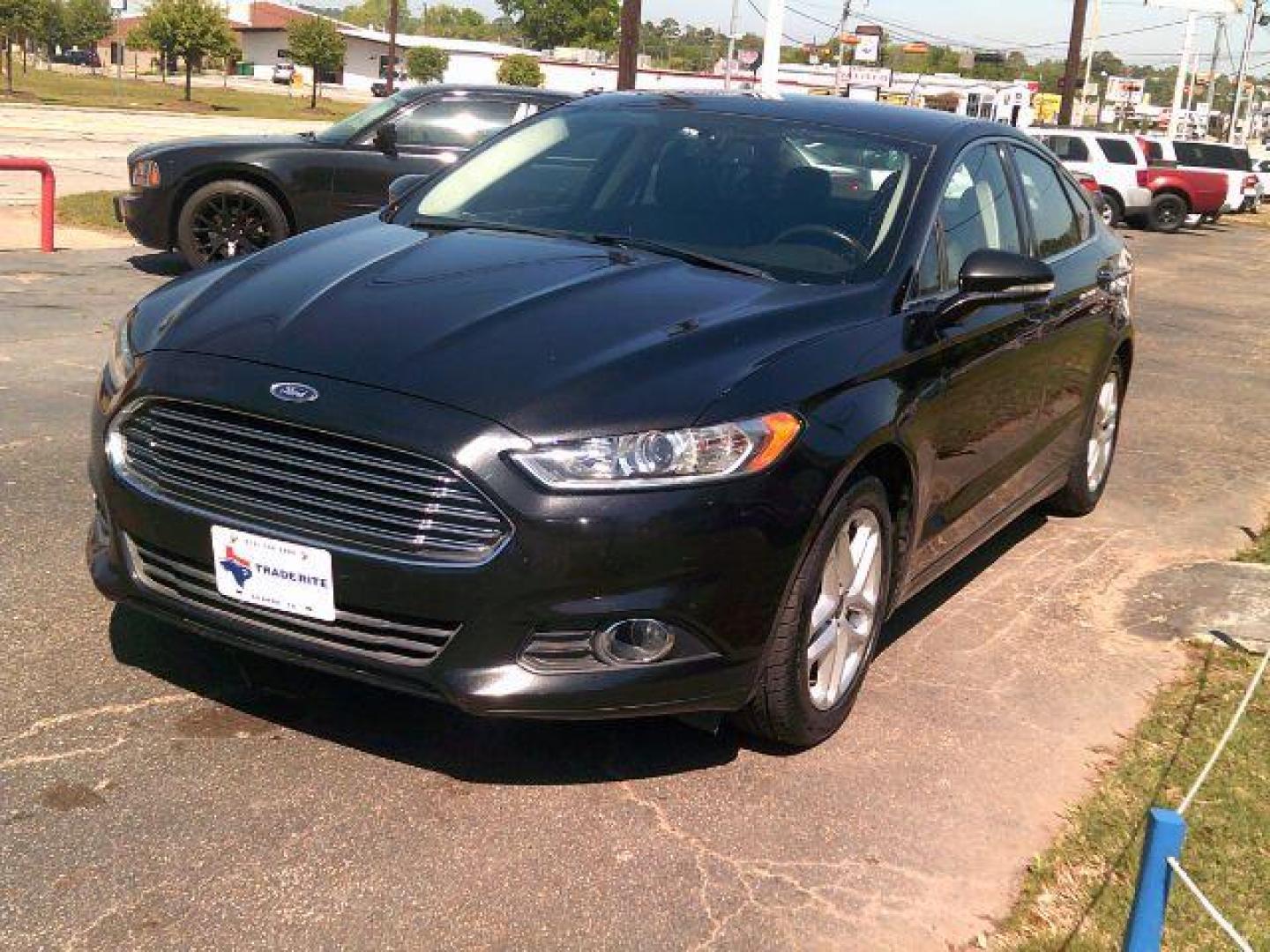 2014 Tuxedo Black Metallic /Ebony Ford Fusion SE (3FA6P0HD5ER) with an 1.5L L4 DOHC 16V engine, 5-Speed Automatic transmission, located at 116 N. Frazier Street, Conroe, TX, 77301, (936) 647-0690, 30.308662, -95.460480 - Photo#2