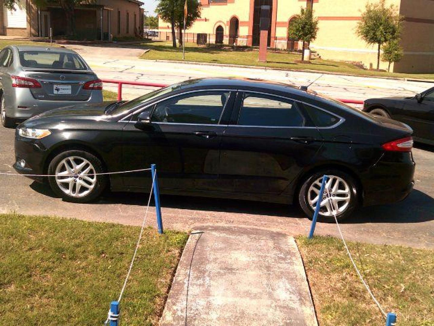 2014 Tuxedo Black Metallic /Ebony Ford Fusion SE (3FA6P0HD5ER) with an 1.5L L4 DOHC 16V engine, 5-Speed Automatic transmission, located at 116 N. Frazier Street, Conroe, TX, 77301, (936) 647-0690, 30.308662, -95.460480 - Photo#3