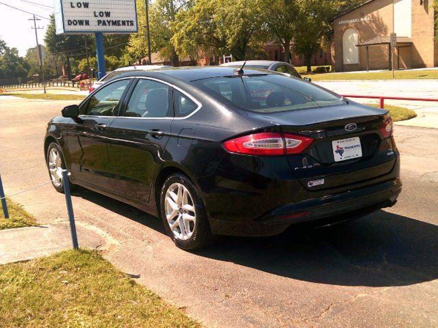 2014 Tuxedo Black Metallic /Ebony Ford Fusion SE (3FA6P0HD5ER) with an 1.5L L4 DOHC 16V engine, 5-Speed Automatic transmission, located at 116 N. Frazier Street, Conroe, TX, 77301, (936) 647-0690, 30.308662, -95.460480 - Photo#4