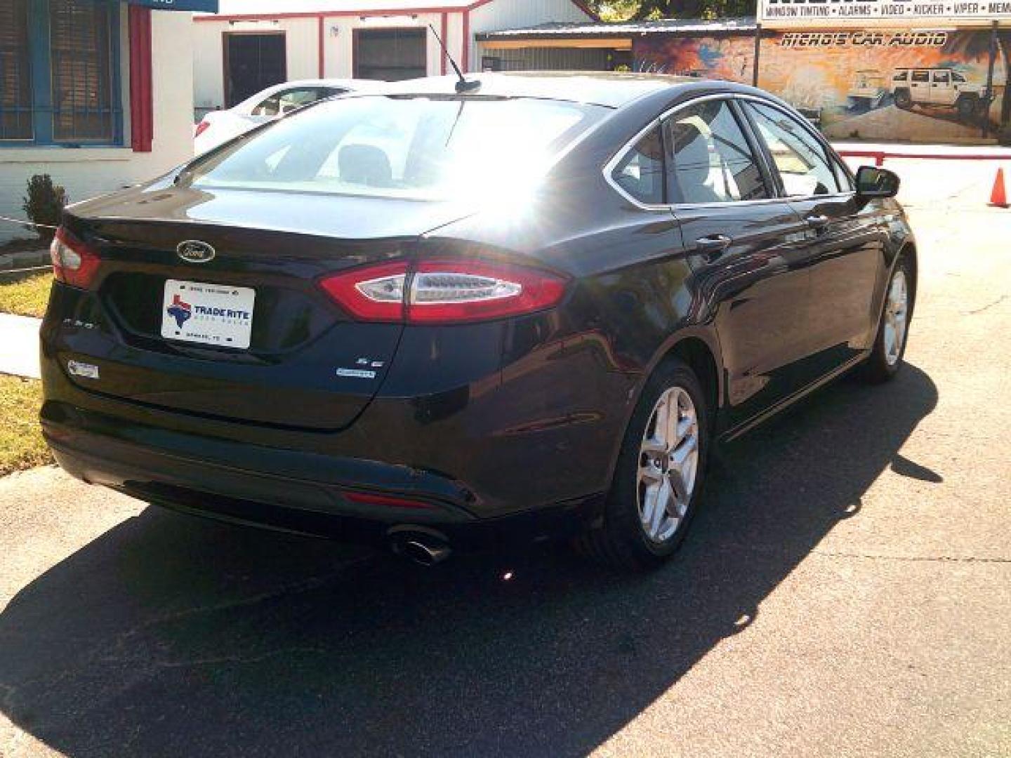 2014 Tuxedo Black Metallic /Ebony Ford Fusion SE (3FA6P0HD5ER) with an 1.5L L4 DOHC 16V engine, 5-Speed Automatic transmission, located at 116 N. Frazier Street, Conroe, TX, 77301, (936) 647-0690, 30.308662, -95.460480 - Photo#5