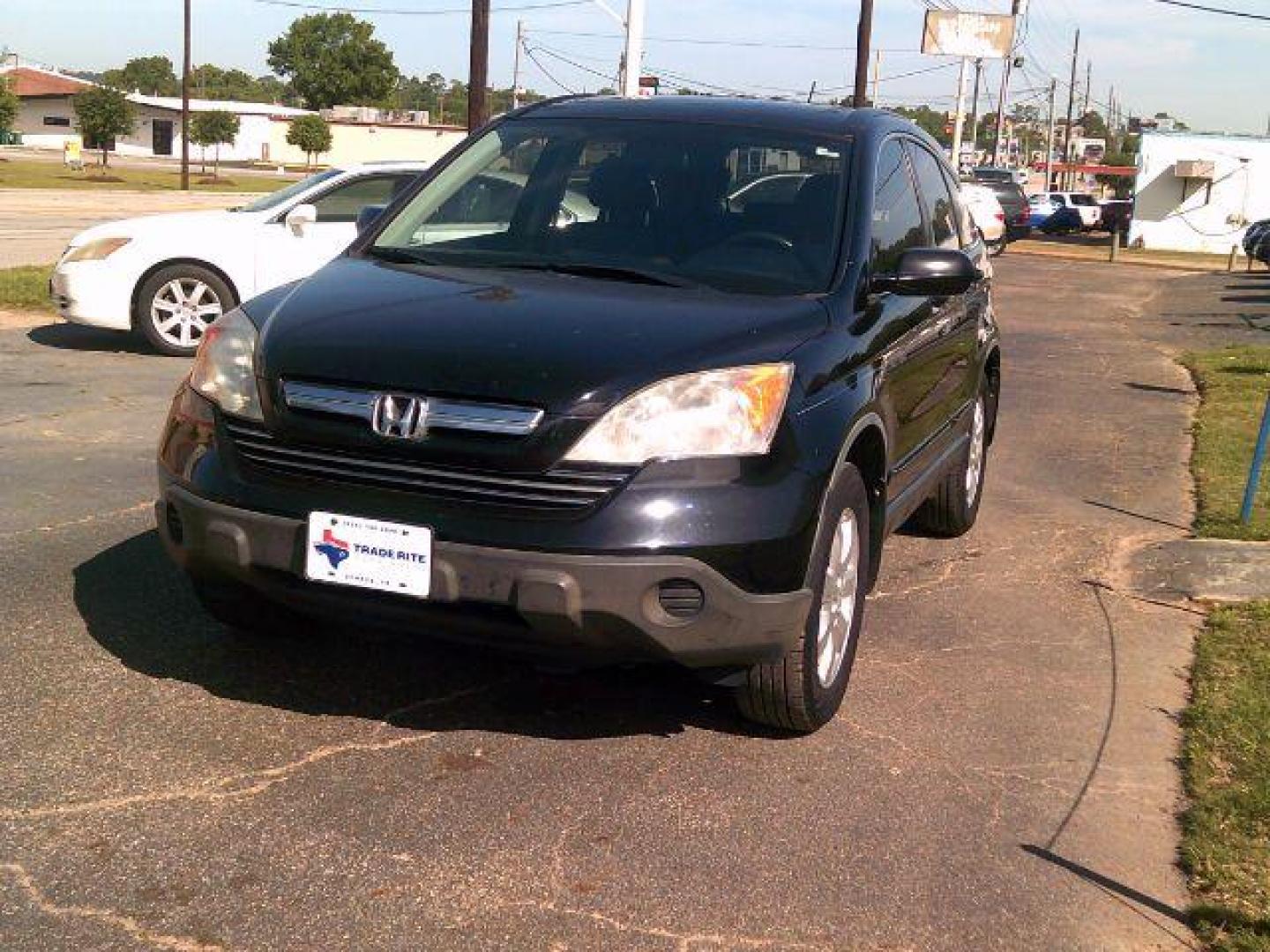 2009 Crystal Black Pearl /Gray Leather Interior Honda CR-V EX-L 2WD 5-Speed AT (JHLRE38799C) with an 2.4L L4 DOHC 16V engine, 5-Speed Automatic transmission, located at 116 N. Frazier Street, Conroe, TX, 77301, (936) 647-0690, 30.308662, -95.460480 - Photo#2