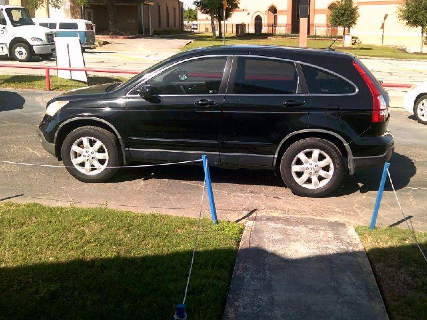 2009 Crystal Black Pearl /Gray Leather Interior Honda CR-V EX-L 2WD 5-Speed AT (JHLRE38799C) with an 2.4L L4 DOHC 16V engine, 5-Speed Automatic transmission, located at 116 N. Frazier Street, Conroe, TX, 77301, (936) 647-0690, 30.308662, -95.460480 - Photo#3