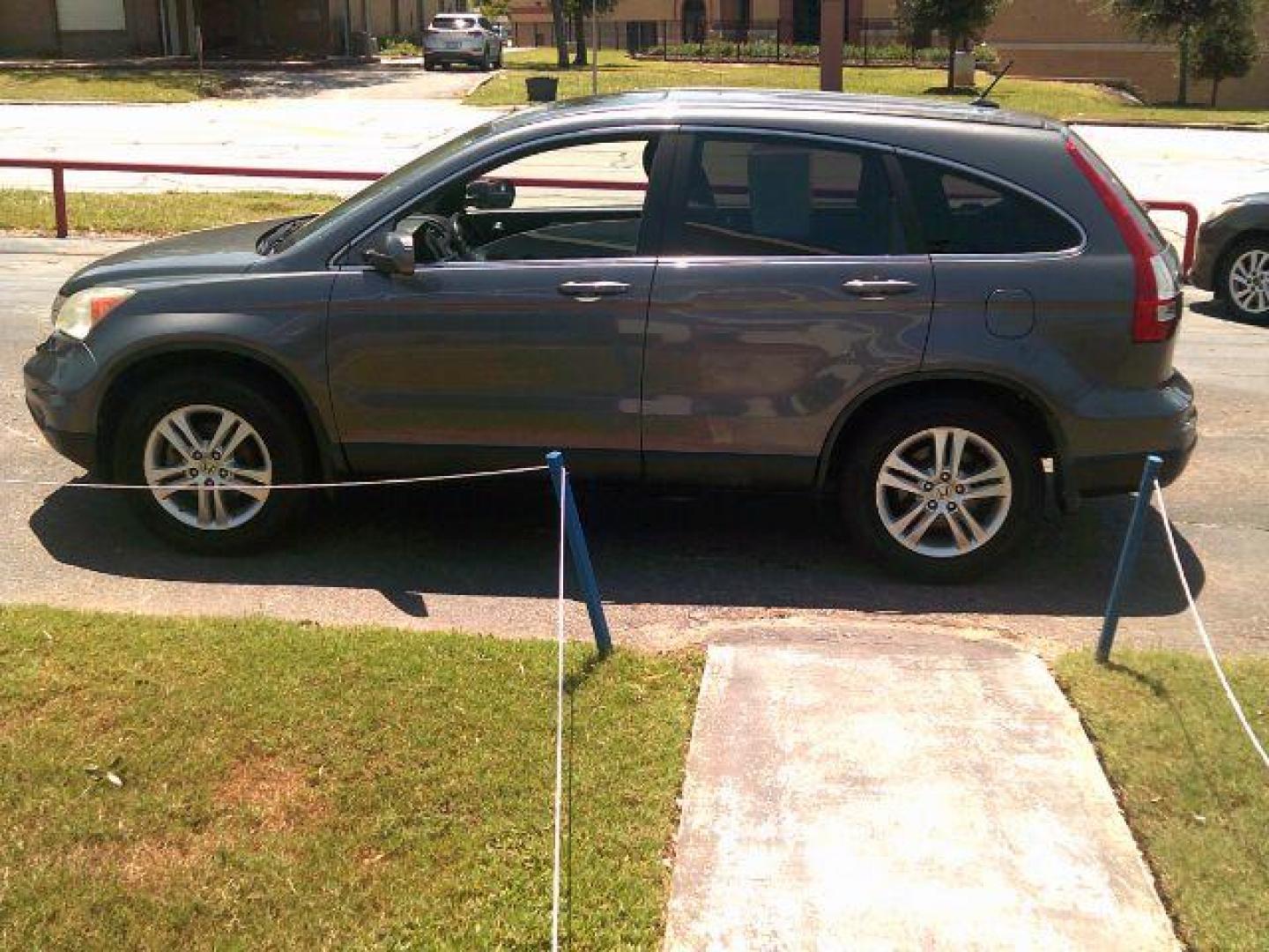 2010 Urban Titanium Metallic /Black Leather Interior Honda CR-V EX-L 4WD 5-Speed AT with Navigation (5J6RE4H7XAL) with an 2.4L L4 DOHC 16V engine, 5-Speed Automatic transmission, located at 116 N. Frazier Street, Conroe, TX, 77301, (936) 647-0690, 30.308662, -95.460480 - Photo#3