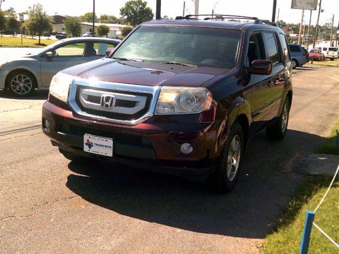 2010 Dark Cherry Pearl /Black Leather Interior Honda Pilot EX-L 2WD 5-Spd AT with DVD (5FNYF3H69AB) with an 3.5L V6 SOHC 24V engine, 5-Speed Automatic transmission, located at 116 N. Frazier Street, Conroe, TX, 77301, (936) 647-0690, 30.308662, -95.460480 - Photo#2