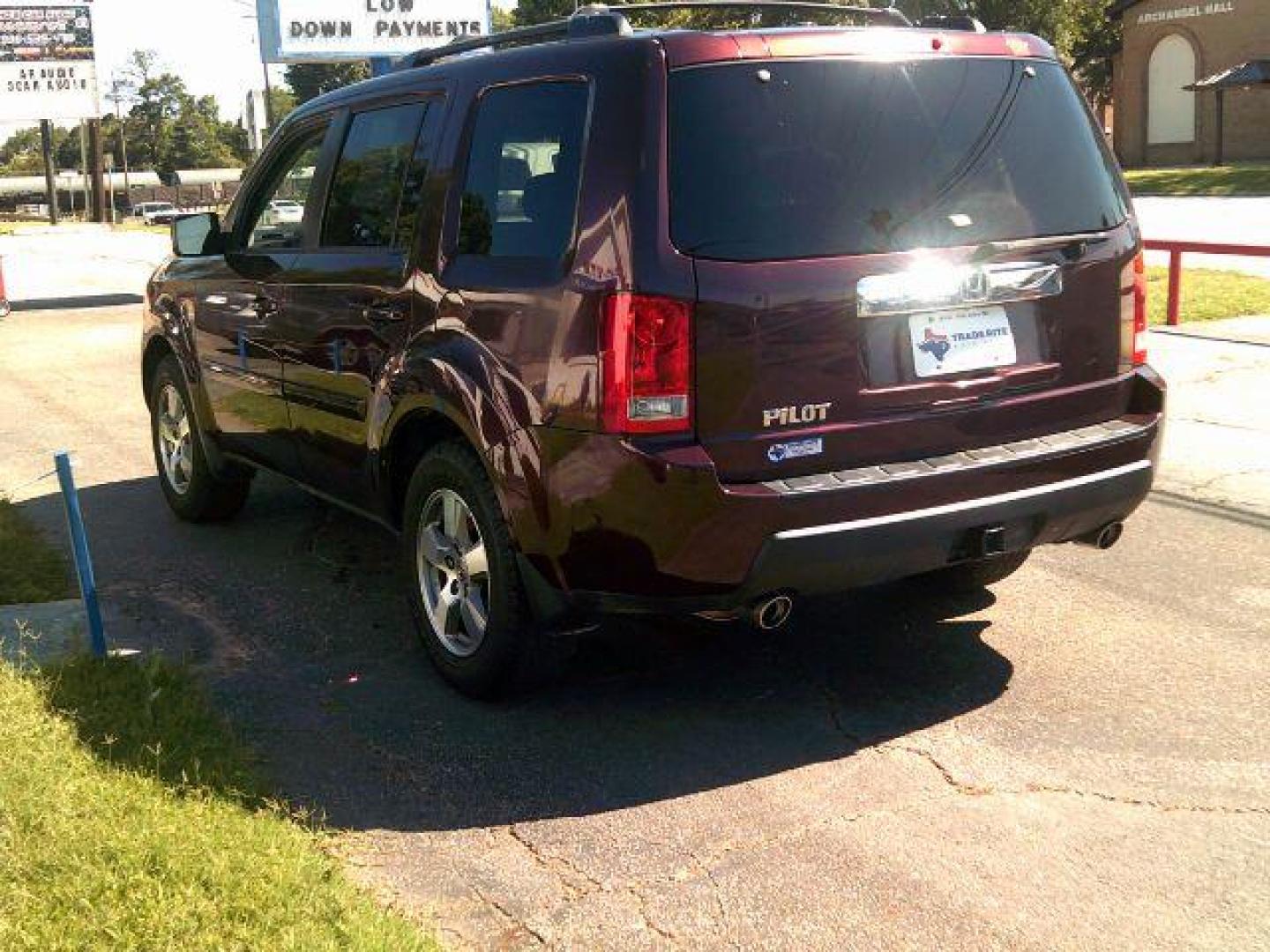 2010 Dark Cherry Pearl /Black Leather Interior Honda Pilot EX-L 2WD 5-Spd AT with DVD (5FNYF3H69AB) with an 3.5L V6 SOHC 24V engine, 5-Speed Automatic transmission, located at 116 N. Frazier Street, Conroe, TX, 77301, (936) 647-0690, 30.308662, -95.460480 - Photo#4