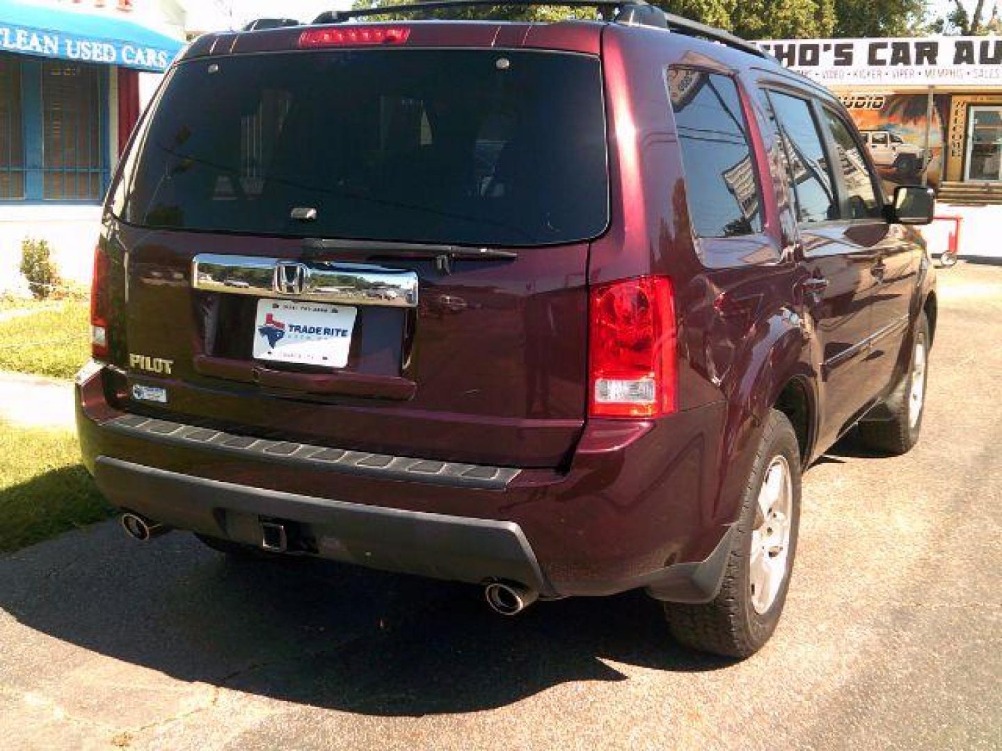 2010 Dark Cherry Pearl /Black Leather Interior Honda Pilot EX-L 2WD 5-Spd AT with DVD (5FNYF3H69AB) with an 3.5L V6 SOHC 24V engine, 5-Speed Automatic transmission, located at 116 N. Frazier Street, Conroe, TX, 77301, (936) 647-0690, 30.308662, -95.460480 - Photo#5