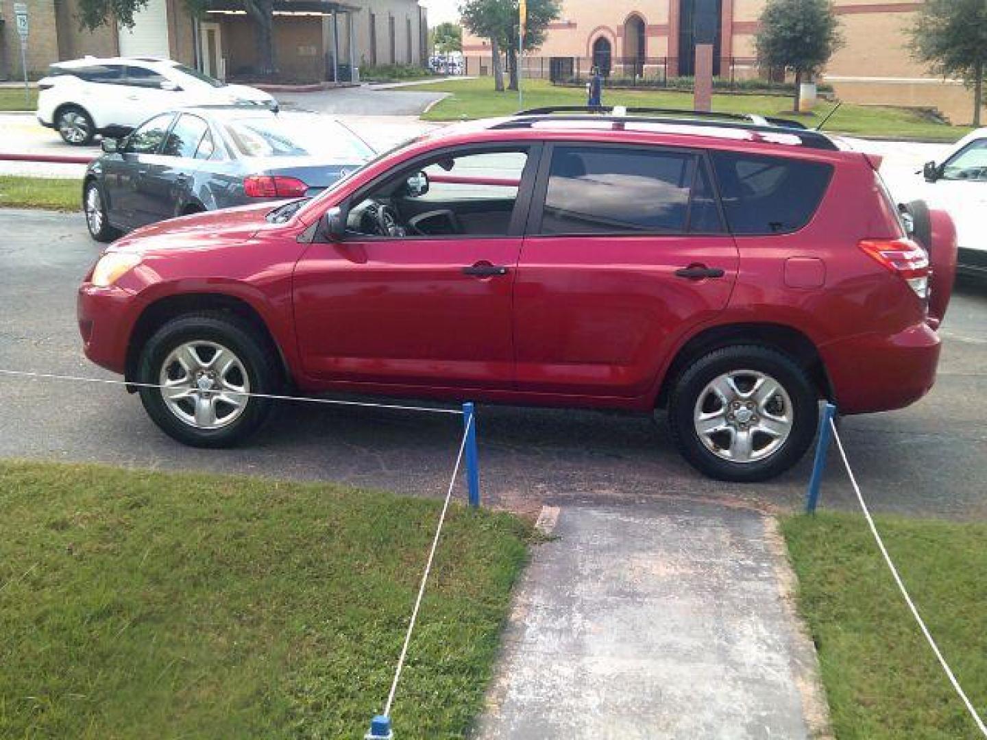 2010 Barcelona Red Metallic /Ash Cloth Interior Toyota RAV4 Base I4 2WD (JTMZF4DV8AD) with an 2.4L L4 DOHC 16V engine, 4-Speed Automatic transmission, located at 116 N. Frazier Street, Conroe, TX, 77301, (936) 647-0690, 30.308662, -95.460480 - Photo#3